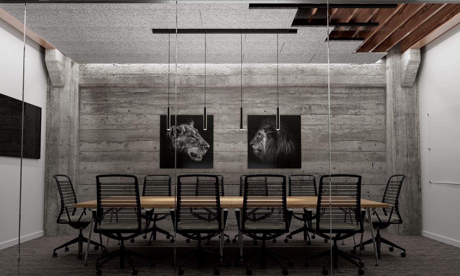 Chaises noires autour d'une grande table dans une salle de réunion moderne et sobre